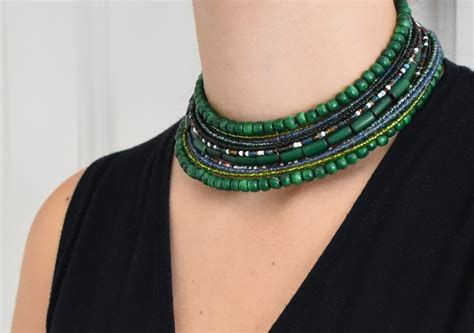 Slika doline Trente z zelenimi travniki in gorami