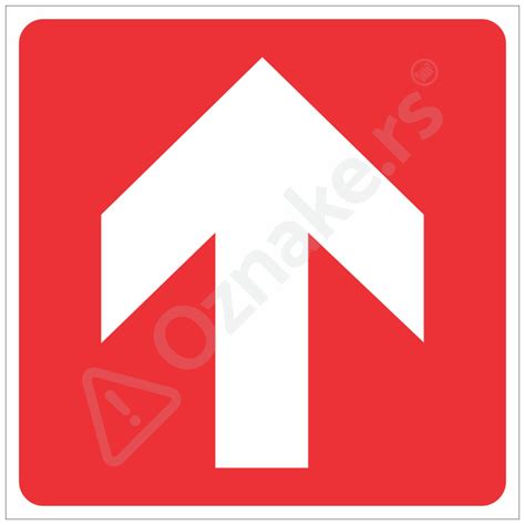 Oznaka rumene puščice na kamnu ob poti