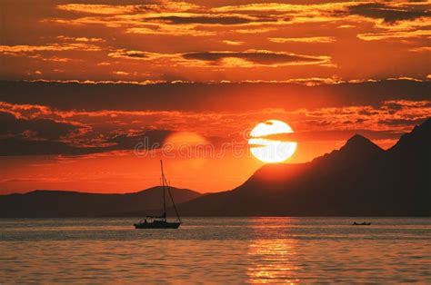 Sunset over the Adriatic Sea with a silhouette of a boat